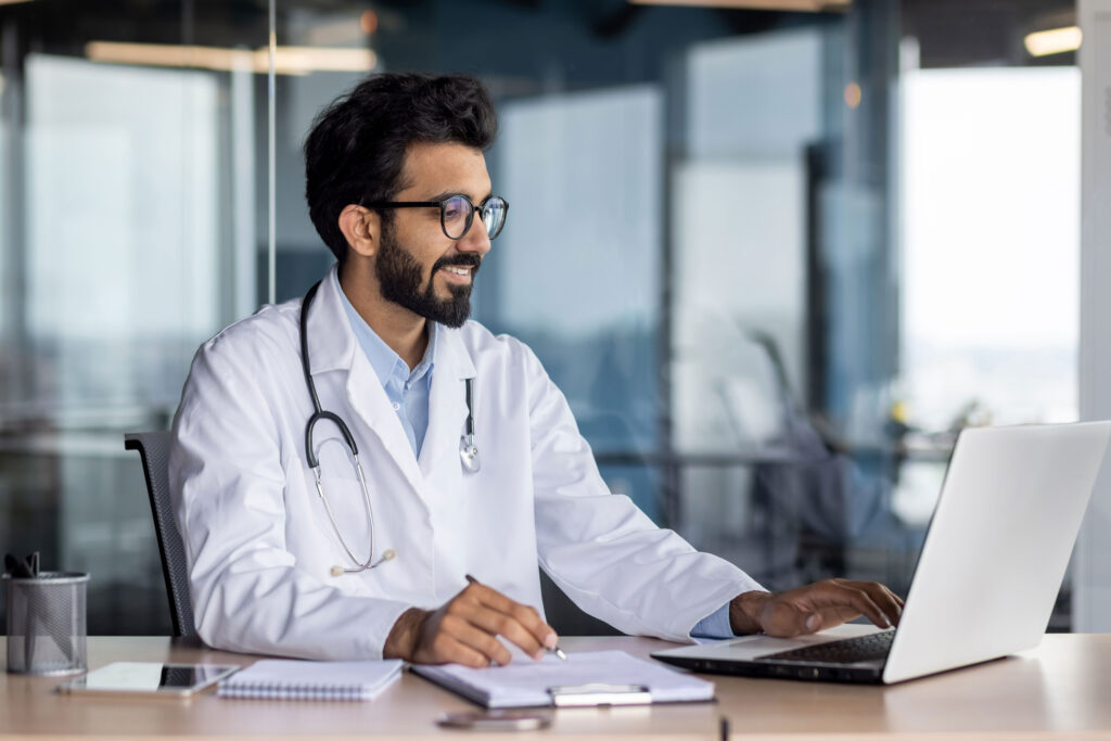 doctor working within an EHR practice management software